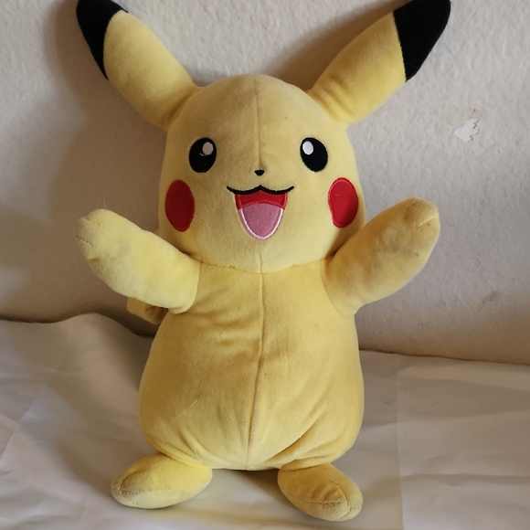 Yellow and Black Stuffed Animal with Cheerful Expression - Picture 1 of 1